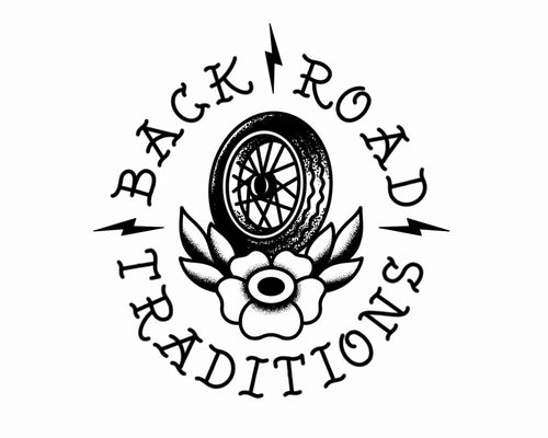 Logo with text 'Back Road Traditions' featuring a wheel and floral design on a white background